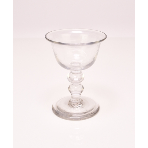 299 - A small English sweetmeat glass, circa 1750, the bell bowl with an averted rim, set above a clear do... 