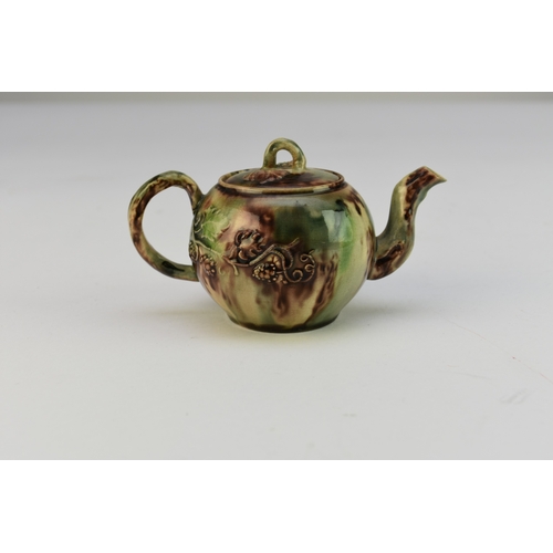 7 - A small Staffordshire 'Whieldon' creamware teapot and cover circa 1750 the globular body applied wit... 