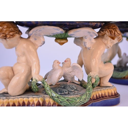 70 - A pair of Minton majolica comports or tazzas, date code for 1864, impressed model number 930, modell... 