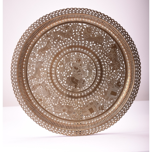 530 - A pair of Indian incised and pierced brass trays or table tops Early 20th century Of circular form, ... 