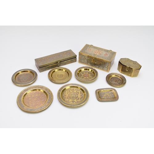 532 - A collection of Cairo type Islamic brassware, with copper and silver inlay, including three boxes, t... 