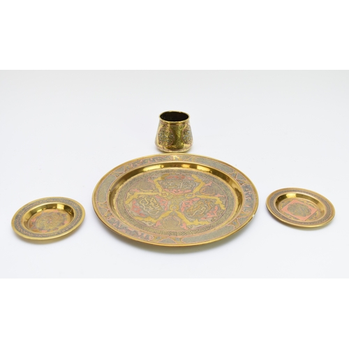 532 - A collection of Cairo type Islamic brassware, with copper and silver inlay, including three boxes, t... 