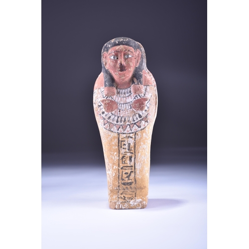 533 - A reproduction Shabti and coffin case, late 19th to early 20th century A miniature wooden coffin con... 