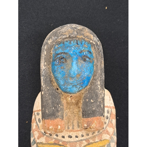 533 - A reproduction Shabti and coffin case, late 19th to early 20th century A miniature wooden coffin con... 