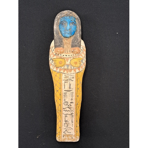 533 - A reproduction Shabti and coffin case, late 19th to early 20th century A miniature wooden coffin con... 