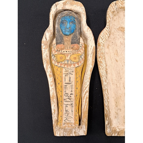 533 - A reproduction Shabti and coffin case, late 19th to early 20th century A miniature wooden coffin con... 