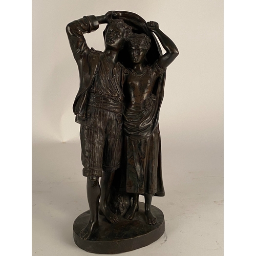 534 - After Fernand Lorrain (19th century), a bronze figure of lovers sheltering from the rain Dark brown ... 