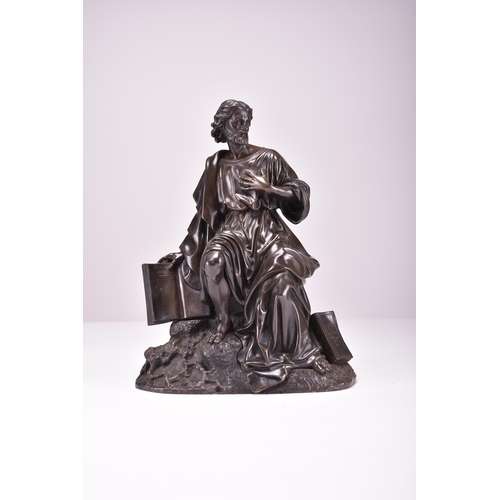 536 - A late 19th century bronze figure of St. Paul Modelled seated on a rocky outcrop and wearing flowing... 