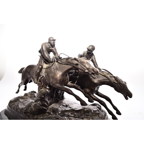 539 - A bronze equestrian group, 20th century Modelled as two steeplechase horses with jockey's in mid jum... 