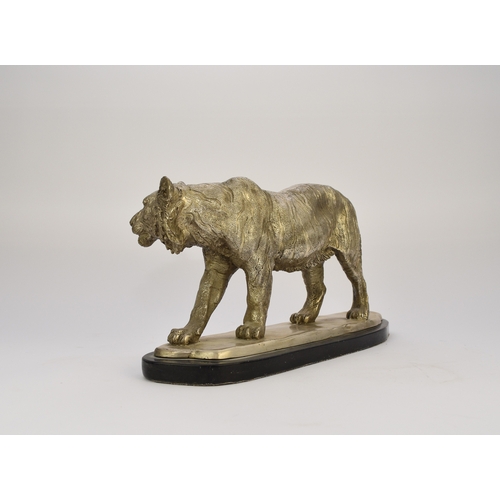 542 - A white metal plated cast resin figure of a tiger Naturalistically modelled standing four square, on... 