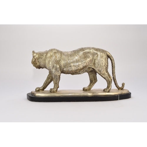 542 - A white metal plated cast resin figure of a tiger Naturalistically modelled standing four square, on... 