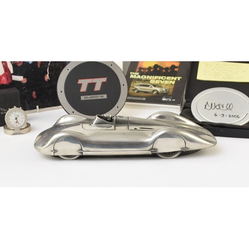 546 - A collection of automotive memorabilia To include: A cast polished metal scale model of The Auto Uni... 