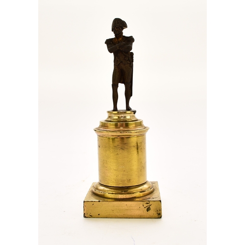 554 - An assembled group of Napoleonic interest, 19th century Including: A small bronze figure of a standi... 