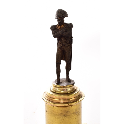 554 - An assembled group of Napoleonic interest, 19th century Including: A small bronze figure of a standi... 