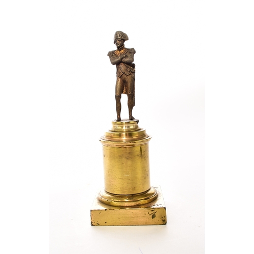 554 - An assembled group of Napoleonic interest, 19th century Including: A small bronze figure of a standi... 