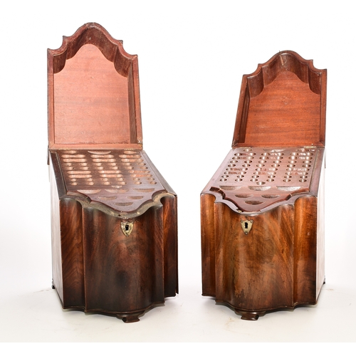 557 - A pair of George III mahogany knife boxes Of typical serpentine form, raised on ogee bracket feet, w... 