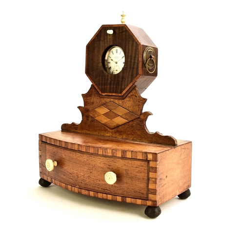 566 - A 19th century inlaid mahogany watch stand The octagonal watch holder raised on a fret cut stand abo... 