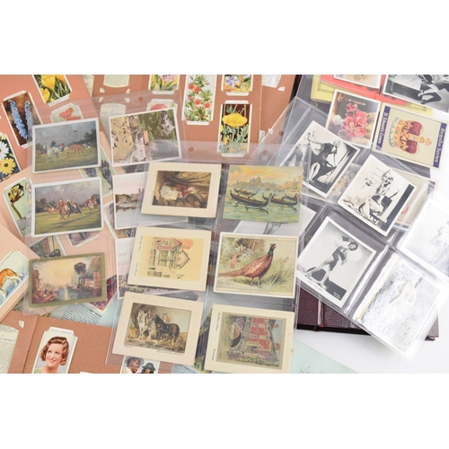 584 - A collection of cigarette cards including Wills and Players sets in album 
