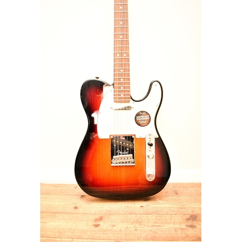 591 - An American Fender Telecaster electric guitar, 2014 In tobacco sunburst with white pick guard, seria... 