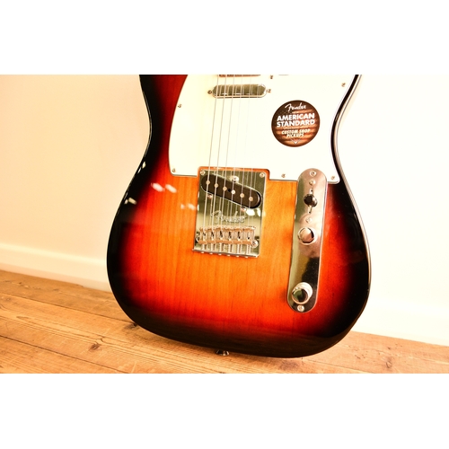 591 - An American Fender Telecaster electric guitar, 2014 In tobacco sunburst with white pick guard, seria... 