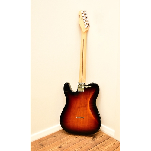 591 - An American Fender Telecaster electric guitar, 2014 In tobacco sunburst with white pick guard, seria... 