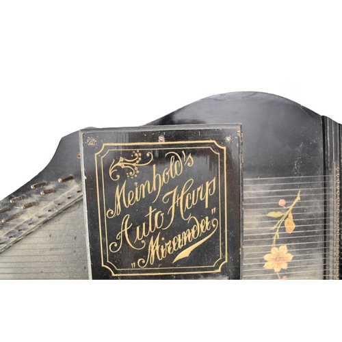 592 - An early 20th century squeeze box concertina Ebonised rosewood inlaid with mother-of-pearl, five fol... 