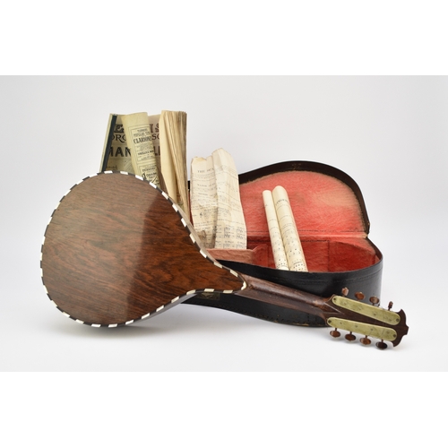 592 - An early 20th century squeeze box concertina Ebonised rosewood inlaid with mother-of-pearl, five fol... 