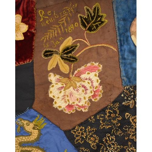 596 - A Victorian embroidered patchwork wall hanging, dated 1892 Worked in asymmetrical coloured fabrics, ... 