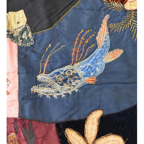 596 - A Victorian embroidered patchwork wall hanging, dated 1892 Worked in asymmetrical coloured fabrics, ... 