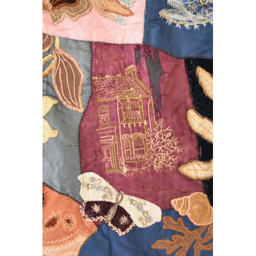 596 - A Victorian embroidered patchwork wall hanging, dated 1892 Worked in asymmetrical coloured fabrics, ... 