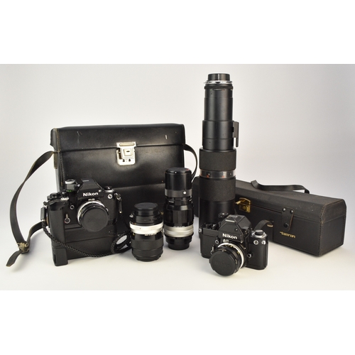 602 - A collection of roll film cameras and lenses To include: Two Nikon F2 35mm SLR camera bodies, circa ... 