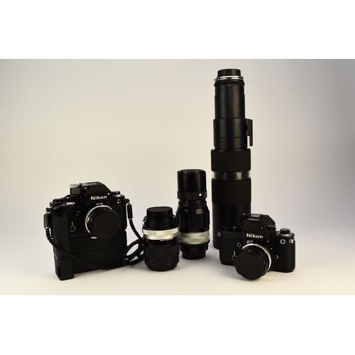 602 - A collection of roll film cameras and lenses To include: Two Nikon F2 35mm SLR camera bodies, circa ... 