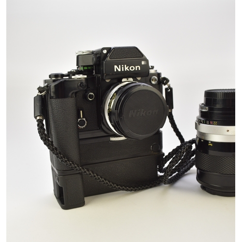 602 - A collection of roll film cameras and lenses To include: Two Nikon F2 35mm SLR camera bodies, circa ... 