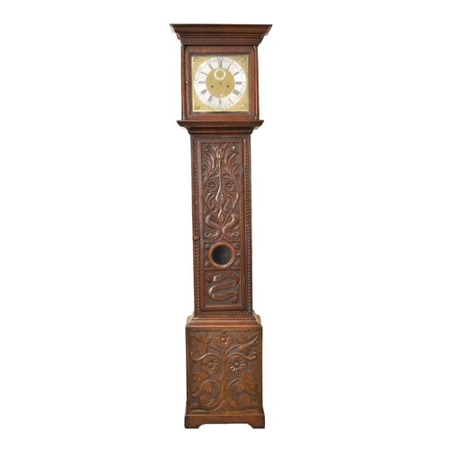 606 - An 18th century oak longcase clock case with associated movement The hood with ogee cornice above tu... 