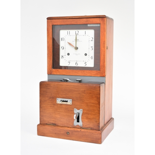 608 - A National Time Recorder Co, factory clock First half 20th century, stained beech case, the 8.25 inc... 