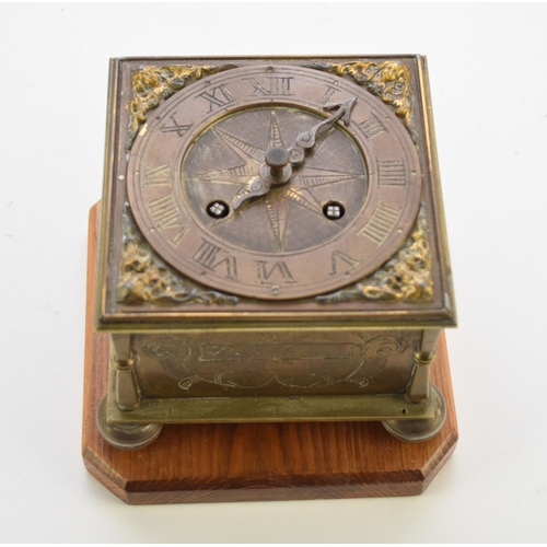 647 - A reproduction brass horizontal table clock In the 16th century style, the square case etched to the... 