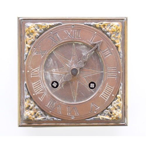 647 - A reproduction brass horizontal table clock In the 16th century style, the square case etched to the... 