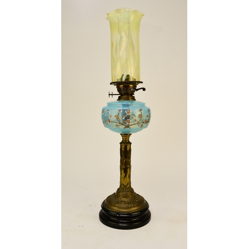 651 - A Victorian brass and enamelled glass oil lamp With vaseline glass cylindrical shade. 73cm high