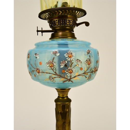 651 - A Victorian brass and enamelled glass oil lamp With vaseline glass cylindrical shade. 73cm high