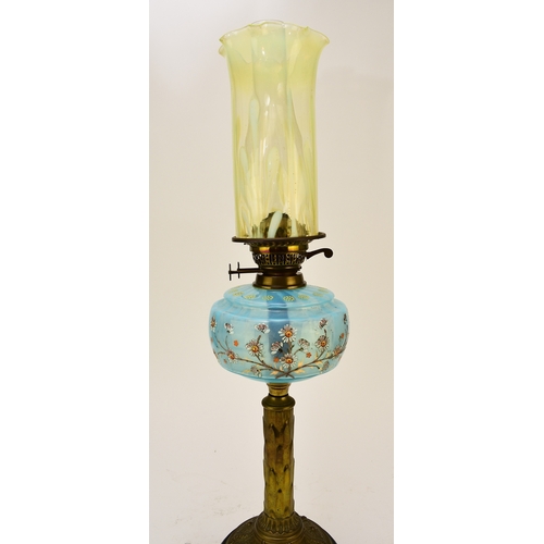 651 - A Victorian brass and enamelled glass oil lamp With vaseline glass cylindrical shade. 73cm high