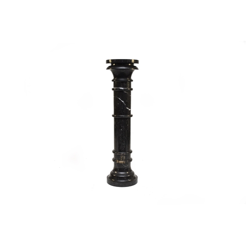 655 - A dark grey veined Sienna marble pedestal or torchère stand With Egyptian style capital, multi-knopp... 