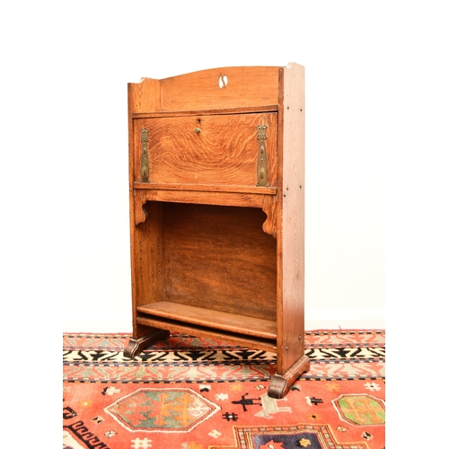 657 - An Arts and Crafts style ash student's desk In the manner of Shapland and Petter, the gallery top wi... 