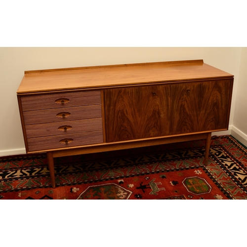 662 - Robert Heritage for Archie Shine: A 'Hamilton' pattern rosewood sideboard Comprising four shallow dr... 