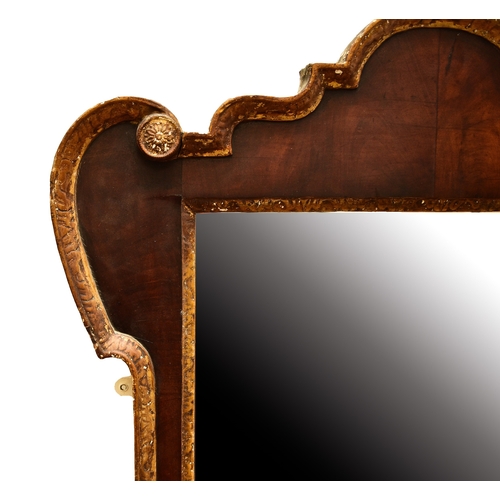 666 - A 19th century gilt gesso and mahogany wall mirror The rectangular plate within a mahogany frame wit... 