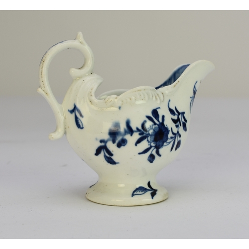 106 - A Derby porcelain 'Cannonball' dolphin cream boat circa 1765-9 painted in underglaze blue, unmarked,... 
