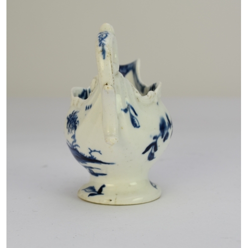 106 - A Derby porcelain 'Cannonball' dolphin cream boat circa 1765-9 painted in underglaze blue, unmarked,... 