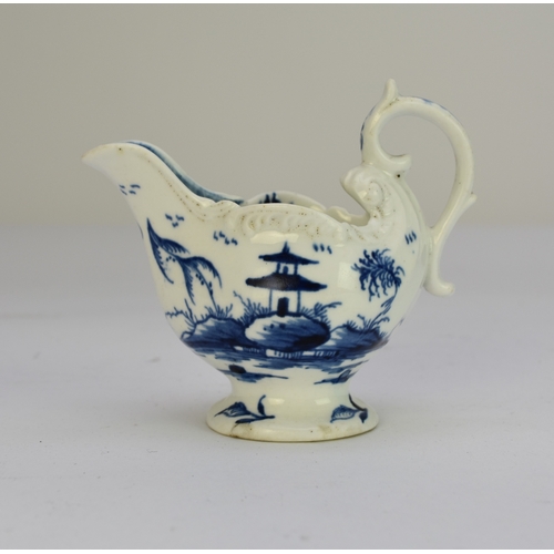 106 - A Derby porcelain 'Cannonball' dolphin cream boat circa 1765-9 painted in underglaze blue, unmarked,... 