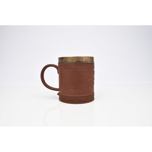 113 - An Elers type red stoneware mug, probably early 18th century, of cylindrical form, with engine-turne... 