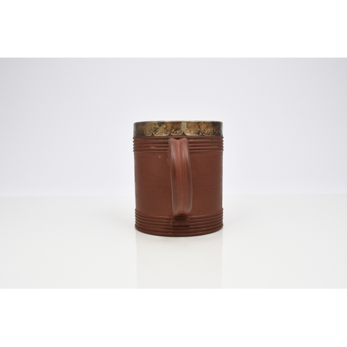 113 - An Elers type red stoneware mug, probably early 18th century, of cylindrical form, with engine-turne... 