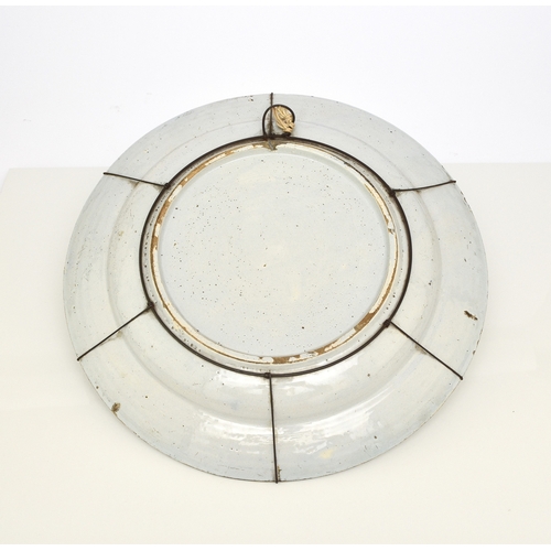 116 - A Bristol delft charger dish, possibly Lime Kiln lane, circa 1720-1735, painted in polychrome with a... 